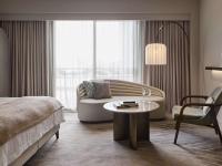 a hotel room with a bed and a couch and a table at The Playford Adelaide - MGallery in Adelaide