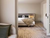 a bedroom with a bed and a couch at The Playford Adelaide - MGallery in Adelaide