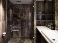 a bathroom with a shower and a sink at The Playford Adelaide - MGallery in Adelaide