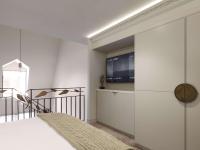 a bedroom with a bed and a tv on a wall at The Playford Adelaide - MGallery in Adelaide