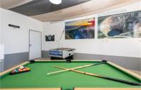 a room with a pool table with bats on it at Stunning Home In Vinjani Donji With 5 Bedrooms, Wifi And Outdoor Swimming Pool in Majići