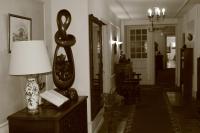 a room with a lamp on a table at Hotel Bel Air in Saint-Jean-de-Luz