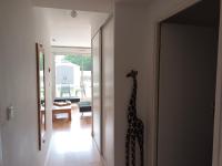 a giraffe standing in the hallway of a house at résidence la clairière aux portes de la baie de Somme in Abbeville