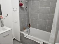 a bathroom with a shower and a tub and a sink at Appartement avec Balcon Pontoise PARIS Nord-ouest in Pontoise