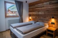 A bed or beds in a room at Casa Angelinat