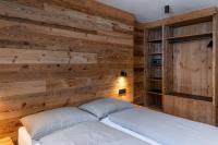 A bed or beds in a room at Casa Angelinat