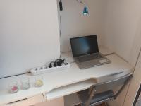 a laptop computer sitting on top of a desk at résidence la clairière aux portes de la baie de Somme in Abbeville