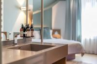 Posteľ alebo postele v izbe v ubytovaní hirschen dornbirn - das boutiquestyle hotel