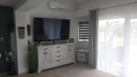 Televízia a/alebo spoločenská miestnosť v ubytovaní Apartman GRIZZLY
