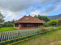 a small house with a fence in front of it at NATURE CASTLE -Traditional villa,Vattavada in Kottakamboor
