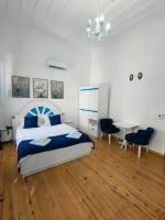 Postel nebo postele na pokoji v ubytování MAVİ PALAS HOTEL