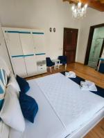 Postel nebo postele na pokoji v ubytování MAVİ PALAS HOTEL