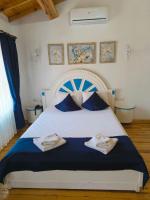 Postel nebo postele na pokoji v ubytování MAVİ PALAS HOTEL