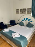 Postel nebo postele na pokoji v ubytování MAVİ PALAS HOTEL