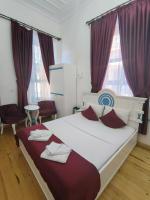 Postel nebo postele na pokoji v ubytování MAVİ PALAS HOTEL