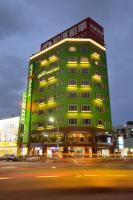 a green building with a street in front of it at Hualien Wow Hostel in Hualien City