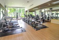 a gym with treadmills and elliptical machines at Katathani Phuket Beach Resort - SHA Extra Plus in Kata Beach