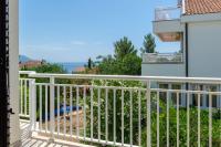 a balcony with a view of the ocean at apartmani stefan in Orebić