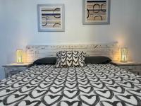 A bed or beds in a room at Low Island House