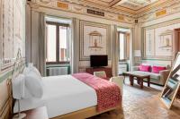 A bed or beds in a room at Palazzo Catalani Resort
