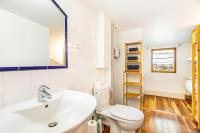 a bathroom with a white toilet and a sink at Double Appartements 2&amp;3 210 sqm up to 18 guests, Villa des Ammonites in Meudon