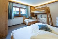 Posteľ alebo postele v izbe v ubytovaní Gästehaus Brantlhof Zimmer und Ferienwohnungen in Going am Wilden Kaiser