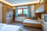 Posteľ alebo postele v izbe v ubytovaní Gästehaus Brantlhof Zimmer und Ferienwohnungen in Going am Wilden Kaiser