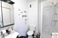 a bathroom with a shower and a toilet and a sink at Pépite Briochine Seh’Loué in Saint-Brieuc