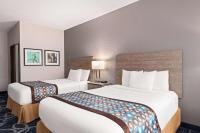 Ein Bett oder Betten in einem Zimmer der Unterkunft Baymont by Wyndham Waterloo