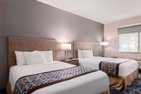 Ein Bett oder Betten in einem Zimmer der Unterkunft Baymont by Wyndham Waterloo