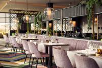 a row of tables and chairs in a restaurant at Van der Valk Hotel Leeuwarden in Leeuwarden