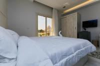 Postel nebo postele na pokoji v ubytování Pyramids Land Hotel
