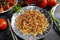 a plate of french fries on a table with tomatoes at Yun Wu B&amp;B in Ren&#39;ai