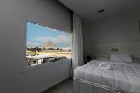 Postel nebo postele na pokoji v ubytování Pyramids Land Hotel