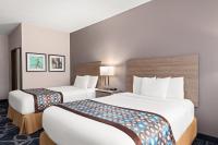Ein Bett oder Betten in einem Zimmer der Unterkunft Baymont by Wyndham Waterloo