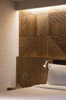 KēSa House, The Unlimited Collection managed by The Ascott Limitedにあるベッド