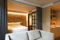 KēSa House, The Unlimited Collection managed by The Ascott Limitedにあるベッド