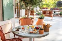 a table with food on it on a patio at La Bastide Bourrelly - Mathias Dandine in Cabriès