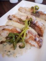 een bord met vlees, kaas en groene paprika's bij Kivuli Beach Resort Paje in Paje