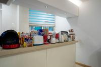 a kitchen counter with a bunch of items on it at Pacific7 Hotel in Pyeongtaek