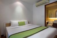 Postel nebo postele na pokoji v ubytování iCheck inn Residences Patong