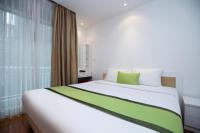 Postel nebo postele na pokoji v ubytování iCheck inn Residences Patong