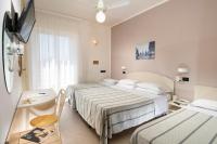 Posteľ alebo postele v izbe v ubytovaní Hotel Astoria