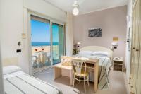 Posteľ alebo postele v izbe v ubytovaní Hotel Astoria
