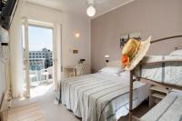 Posteľ alebo postele v izbe v ubytovaní Hotel Astoria