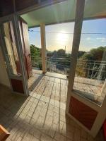 an open door to a balcony with a view at Télétravail et Plaisir au soleil avec vue mer! in Bouillante