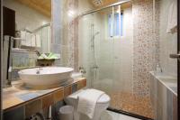 a bathroom with a sink and a toilet and a shower at Sweet Heart B&amp;B in Ji&#39;an