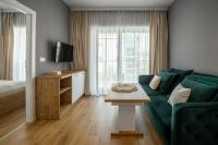 Televízia a/alebo spoločenská miestnosť v ubytovaní Apartamenty KAPRYS - Centrum