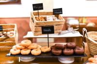 a display of donuts on a table in a bakery at ALEGRIA Bodega Real in El Puerto de Santa María