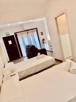 Posteľ alebo postele v izbe v ubytovaní Apartamentos Pintor Losada